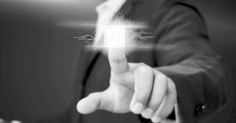 A hand reaching towards a glowing AI processor icon on a digital interface.